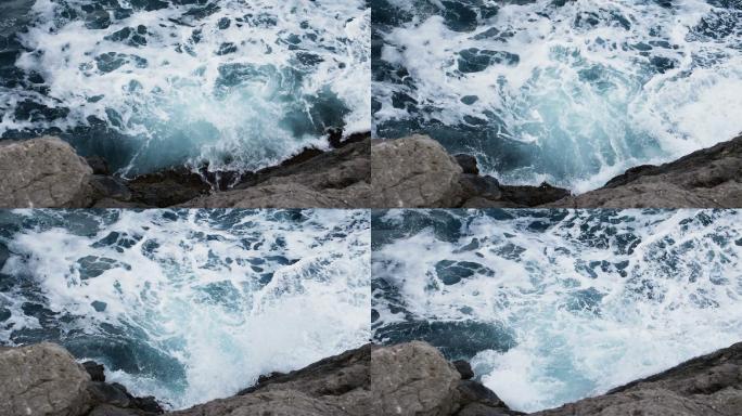 潮汐冲击时海浪溅起湿崖