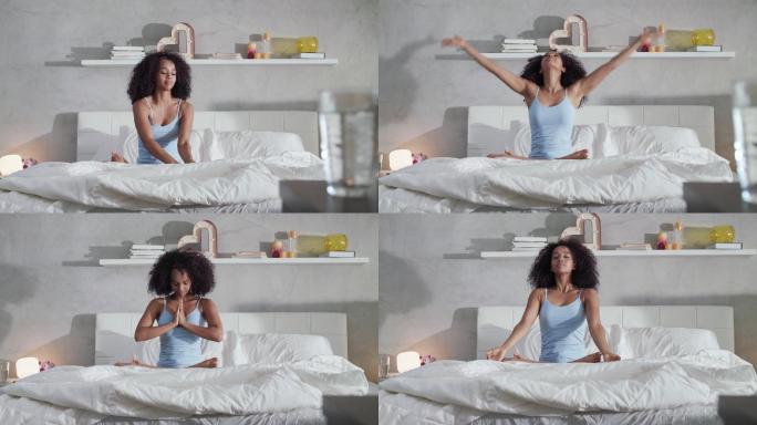 妇女睡后在床上做瑜伽