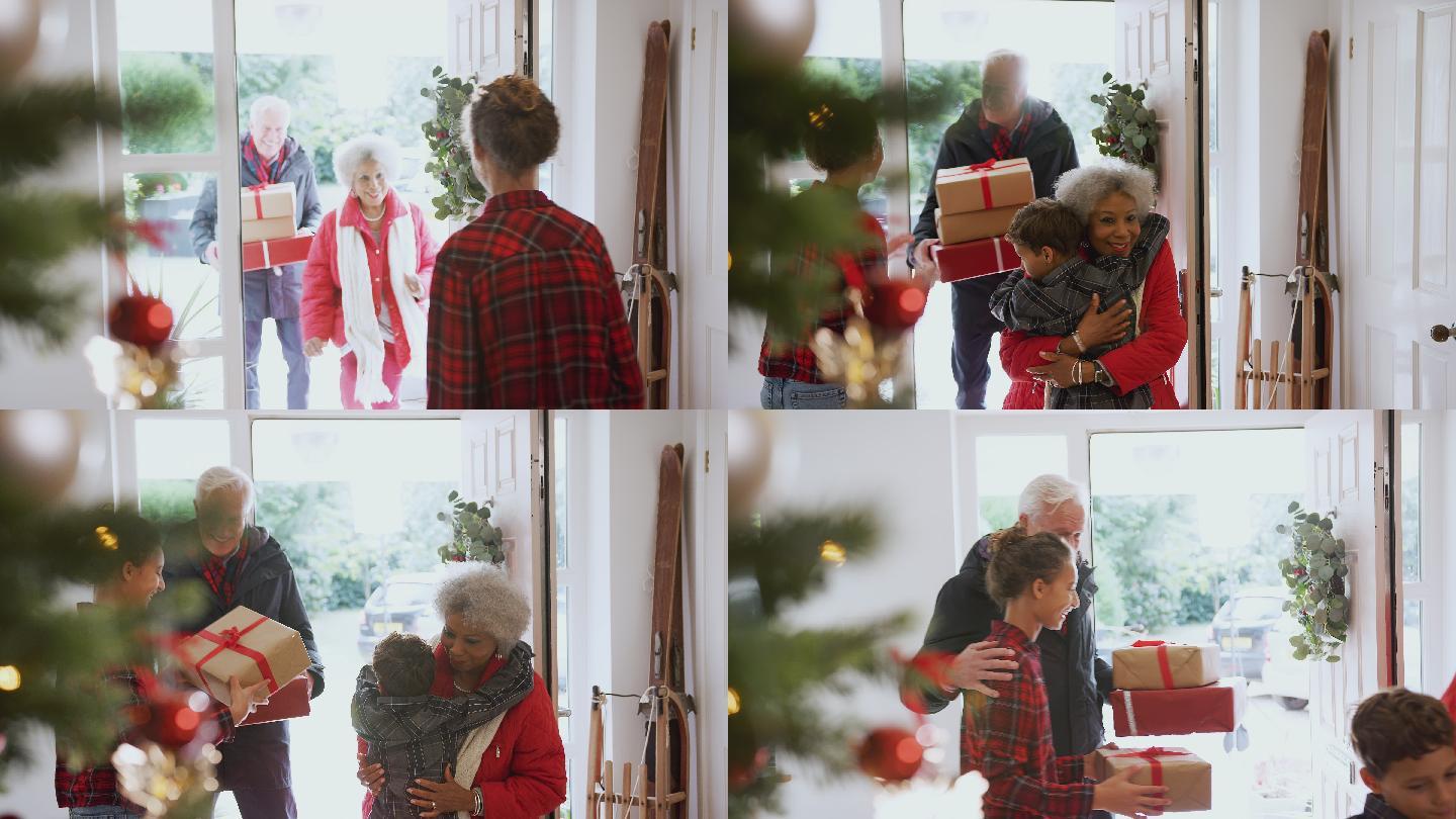 兴奋的孙辈们在圣诞节带着礼物去拜访祖父母