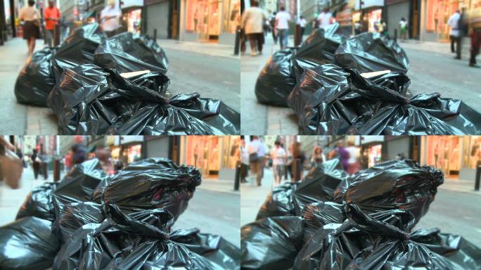 城市垃圾废弃物黑色塑料袋人流空镜