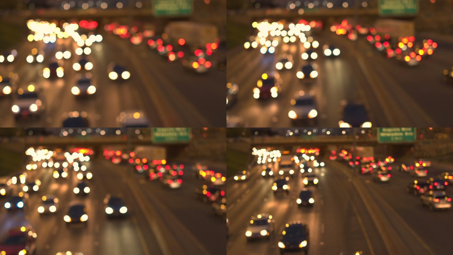 夜晚繁忙的多车道公路上的模糊车灯