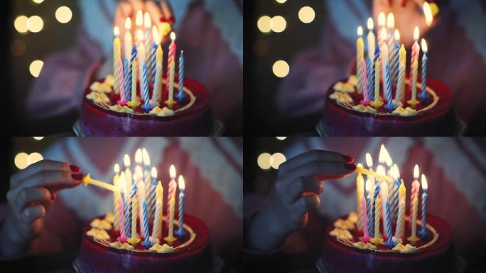 小女孩在生日蛋糕上点蜡烛