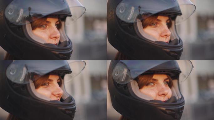 戴头盔的年轻女摩托车手