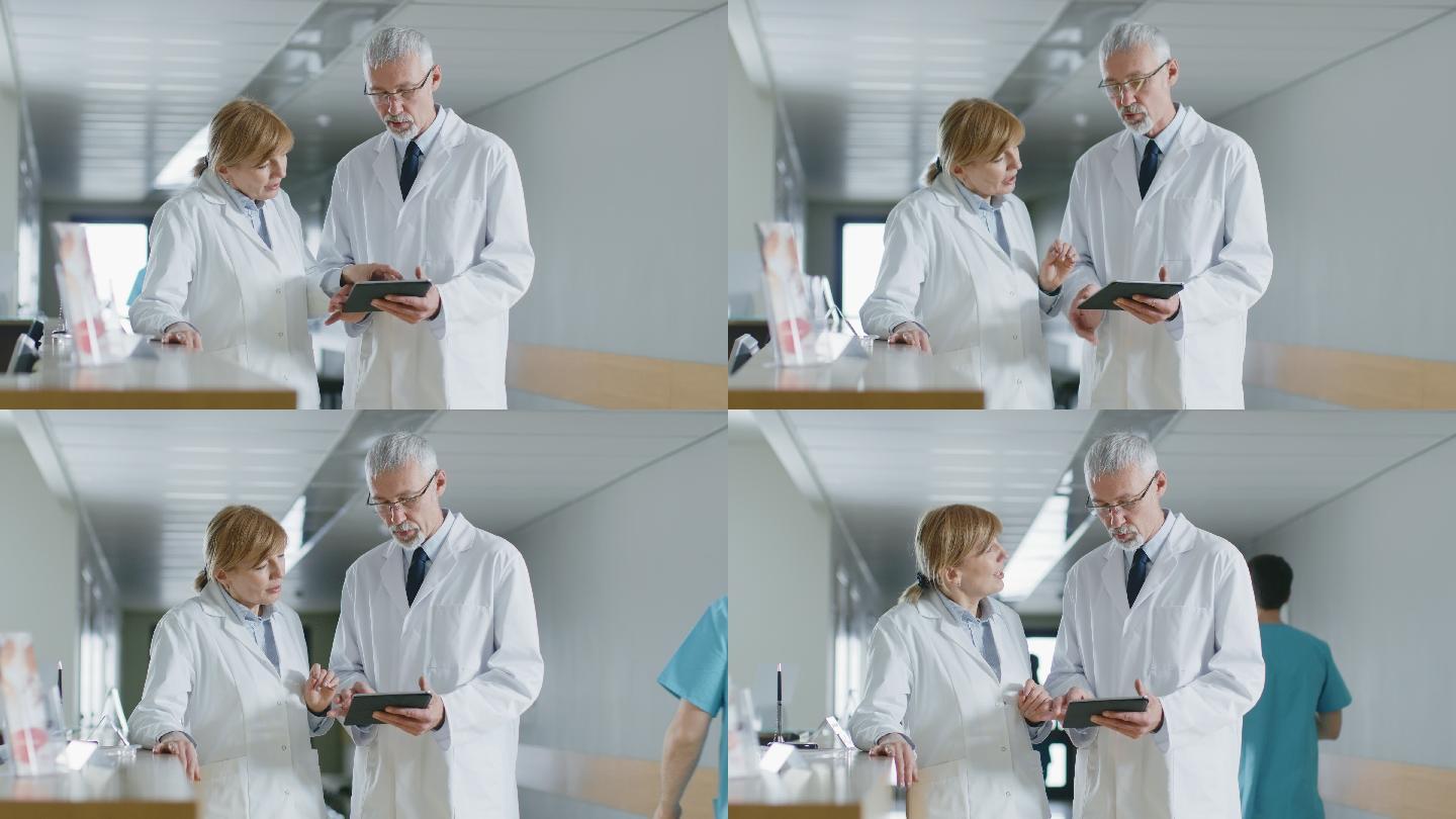 两名医生通过平板电脑交谈和分享信息。