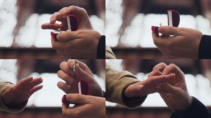 男人拿着结婚戒指向女友求婚