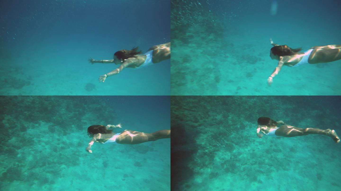 女子在水下慢动作游泳