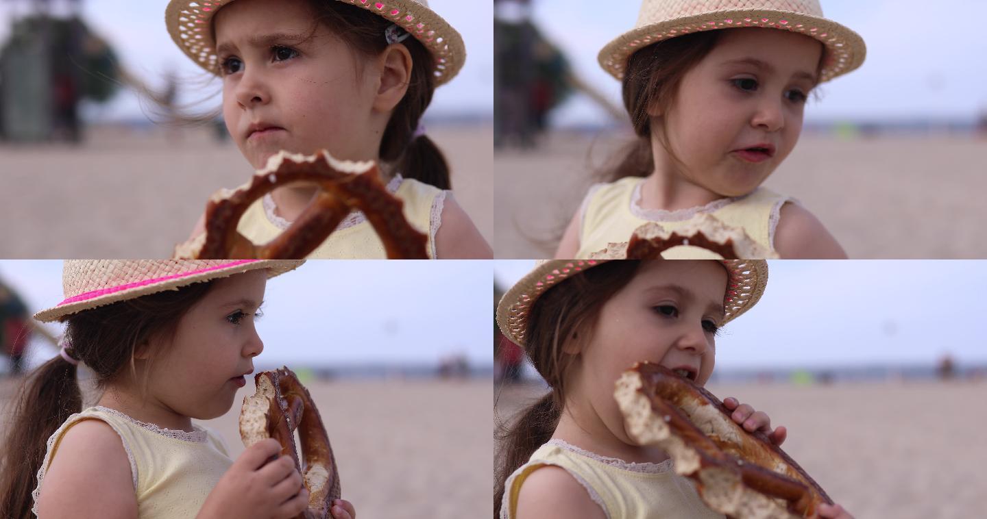 3岁女孩吃甜甜圈可爱小姑娘饿了吃东西