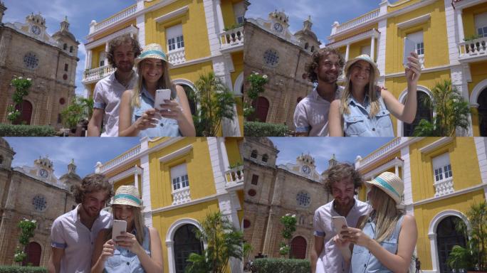 一对旅游年轻夫妇用智能手机自拍