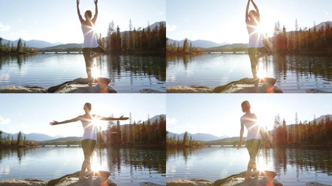 在湖边日落时练习瑜伽的年轻苗条女子