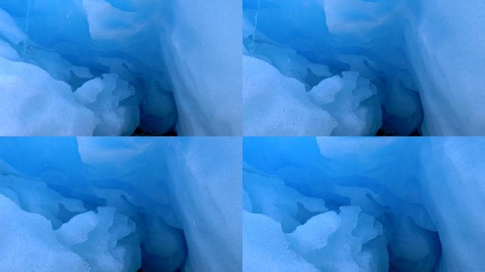 照相机在蓝色冰川中移动。