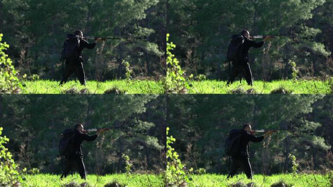 带步枪的猎人瞄准树木步枪瞄准器