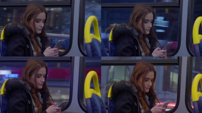 女生在巴士上用智能手机