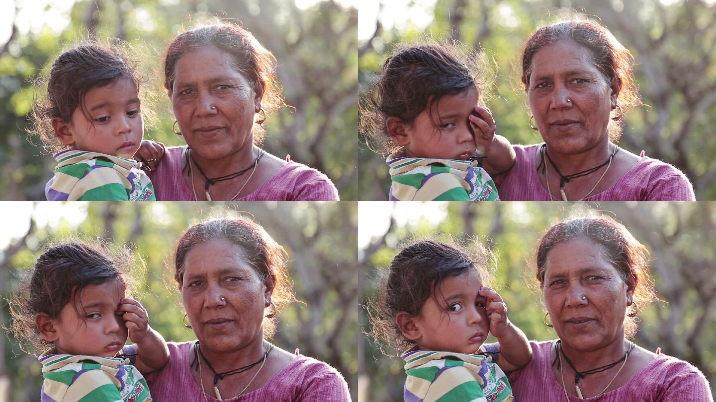 抱着孙女的祖母印度女人巴基斯坦小女孩