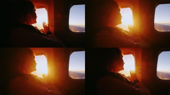 从飞机的窗口触碰光