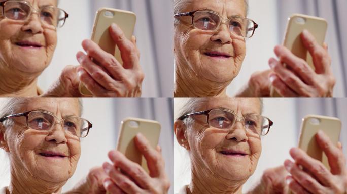 一个老年人正在使用智能手机