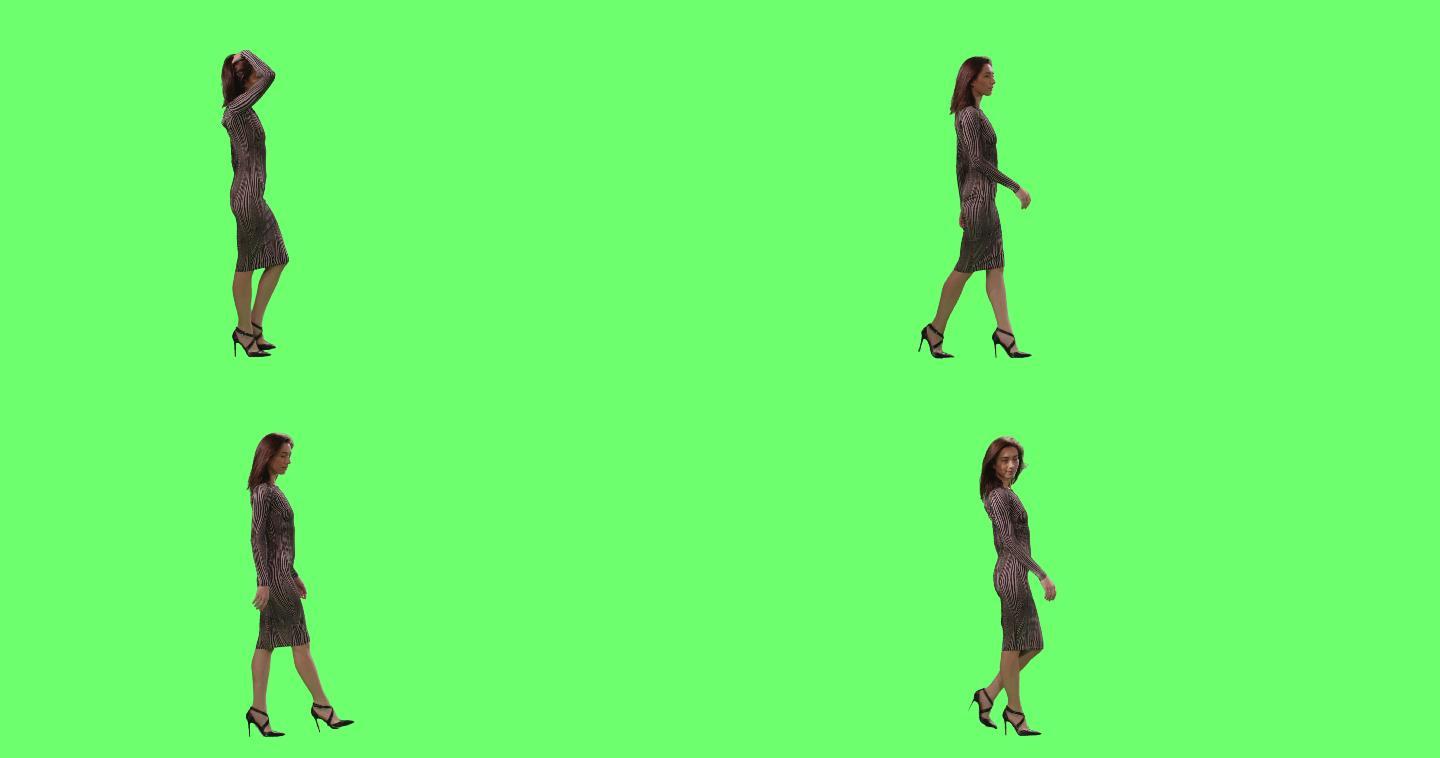 女性优雅地走在模拟绿色屏幕上