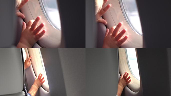 小孩透过飞机窗口观察