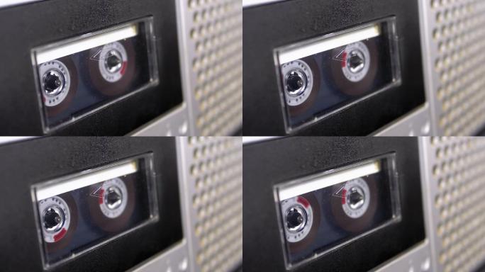 盒式磁带插入录音机的磁带盒中播放并旋转