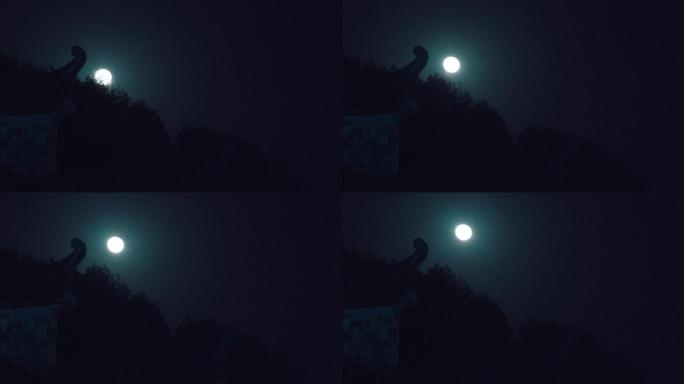 月亮从房檐中升空
