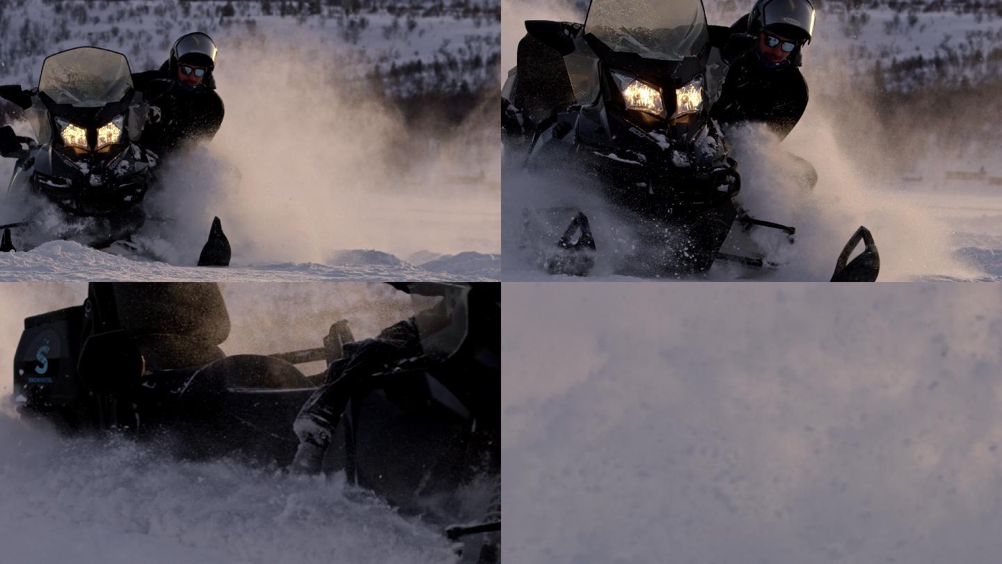 在雪地驾驶雪地摩托车的男人