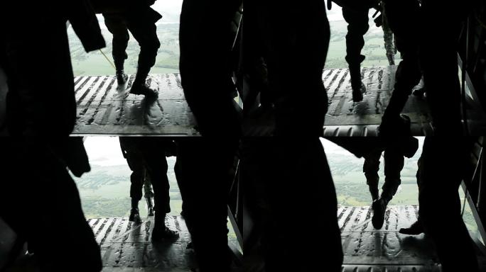 军队士兵从军用运输机上跳伞的特写镜头