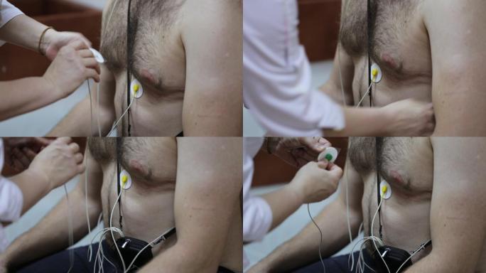 女医生在患者胸部安装电极进行日常监测