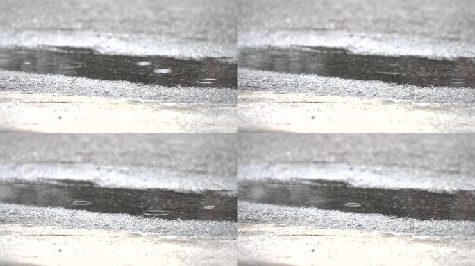 低角度下雨的小水坑特写镜头