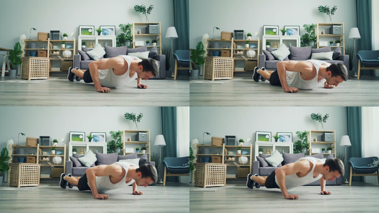 男人在家做俯卧撑锻炼身体一个人在家里