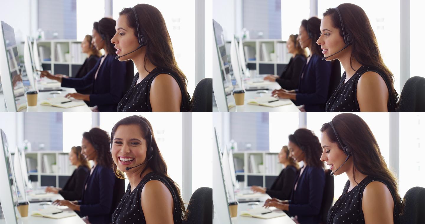 女子在现代办公室使用电脑和耳机的4k视频