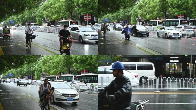下雨天城市街道骑电动车的人们