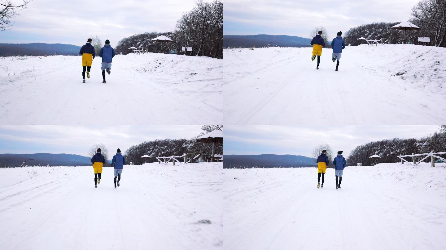 两名运动员在雪地上慢跑
