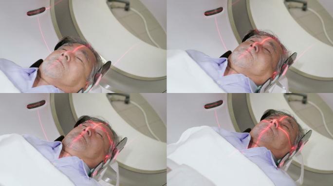 中年男子躺在CT扫描仪上