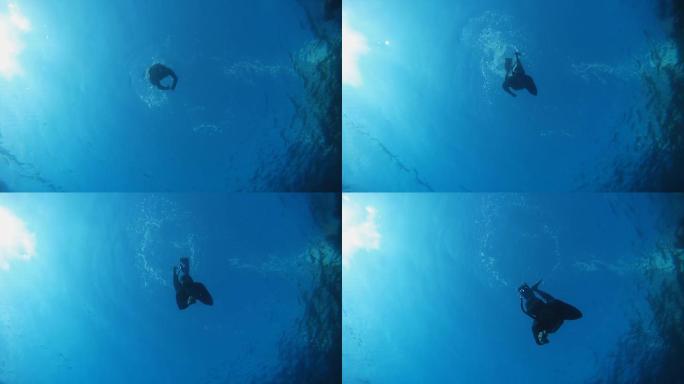 高清慢镜头：潜水员靠近摄像机