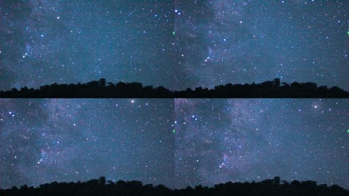 夜晚，恒星和银河在山上的长时间曝光。