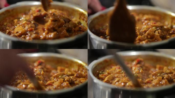 咖喱鸡特写镜头勺子搅拌印度食品