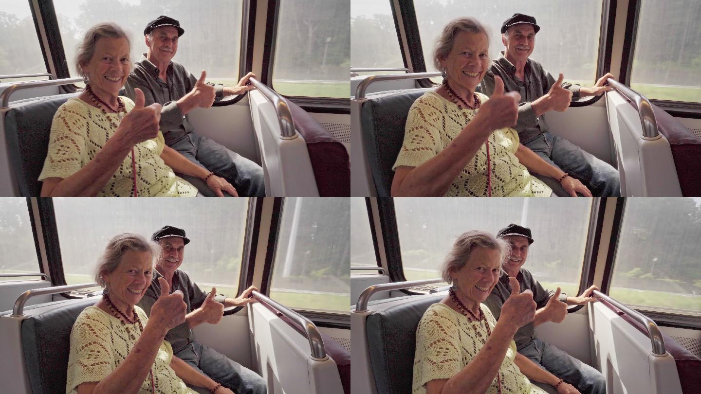 快乐的老年夫妇在地铁上竖起大拇指