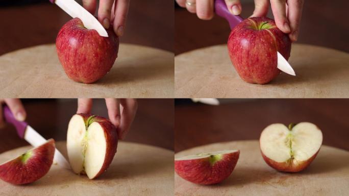 特写在木板上切红苹果。