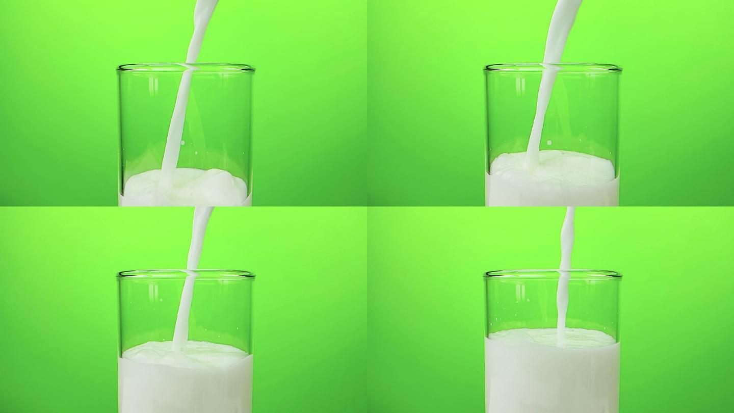 绿色背景前的牛奶