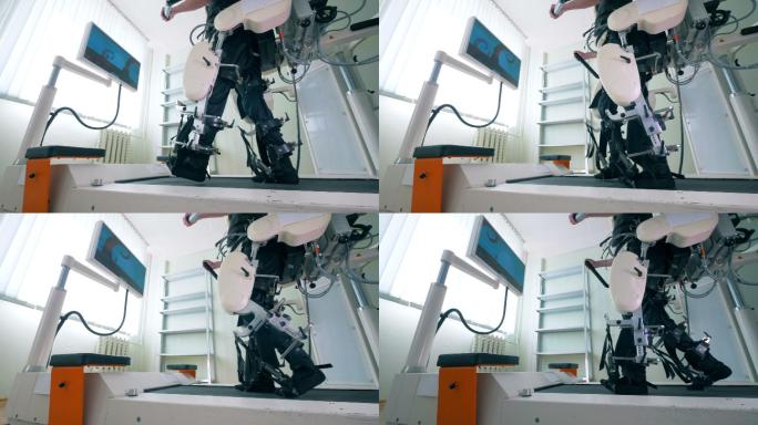 身体残障的人正在使用电子医疗机器人训练