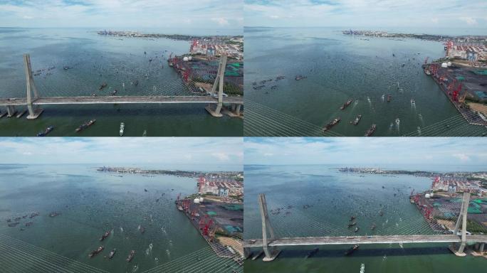 航拍海南省儋州市白马井港洋浦大桥渔船出海