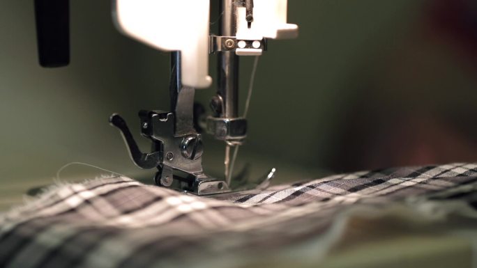 缝纫机缝制衣服，针头特写