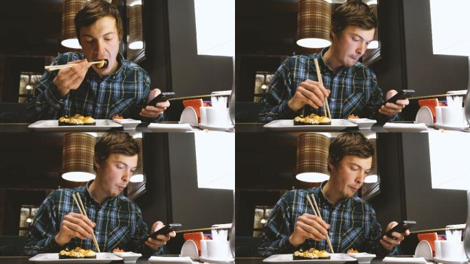 边吃寿司边玩手机