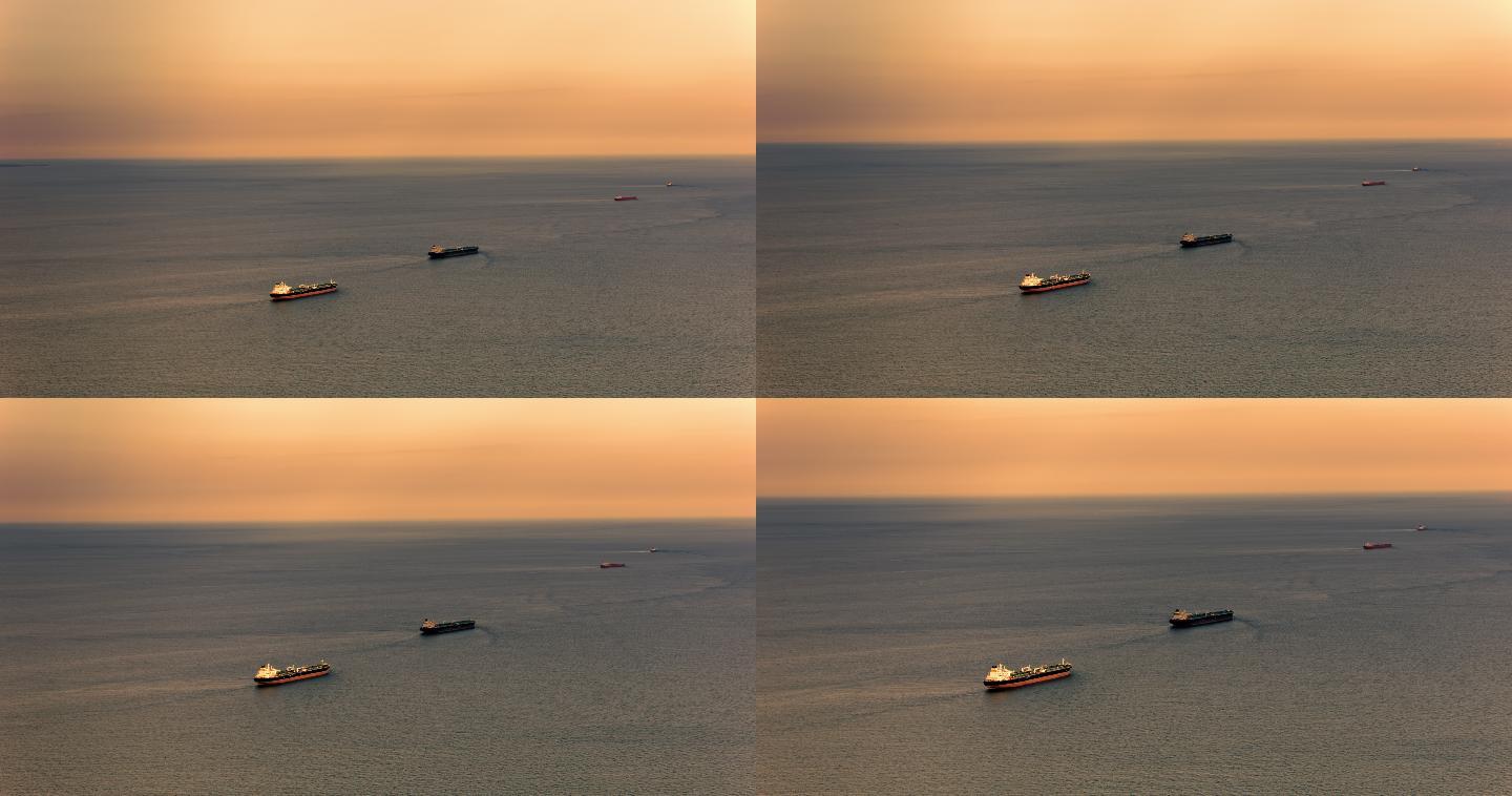 日落时在海面航行的大型货船