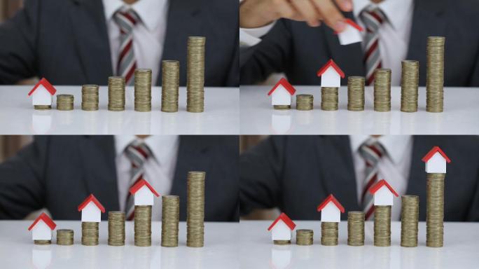 房屋模型和硬币堆房地产杠杆资本积累