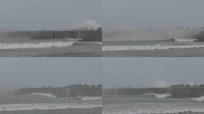 风暴海浪冲破港口的海堤