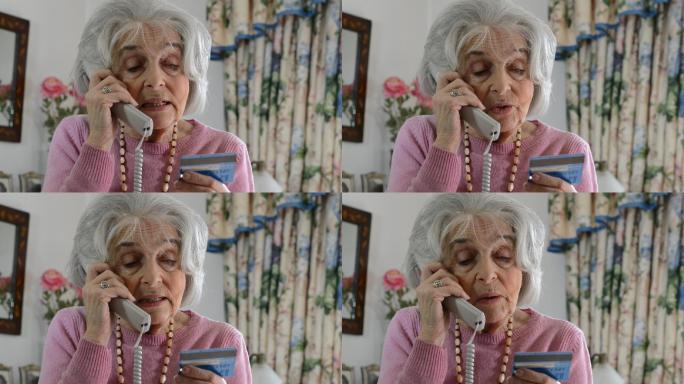 在电话中提供信用卡详细信息的老年妇女