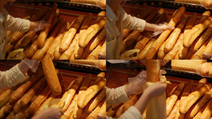 在面包店购买新鲜法式面包的女性顾客
