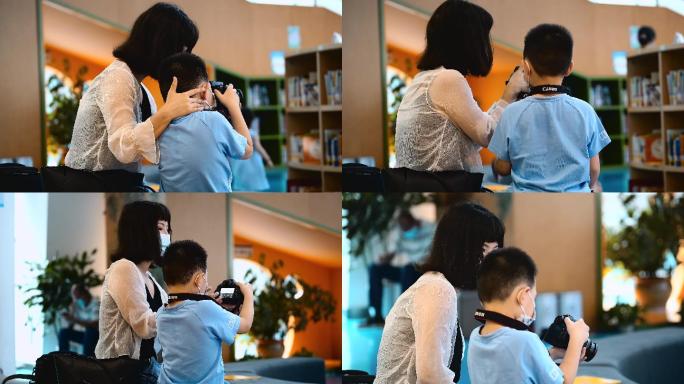 4K母亲教孩子使用单反相机空镜