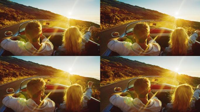 一对夫妇开车欣赏夕阳