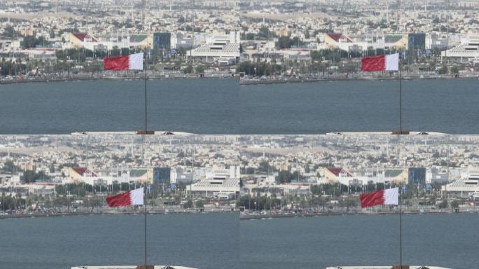 卡塔尔国旗在多哈迎风飘扬